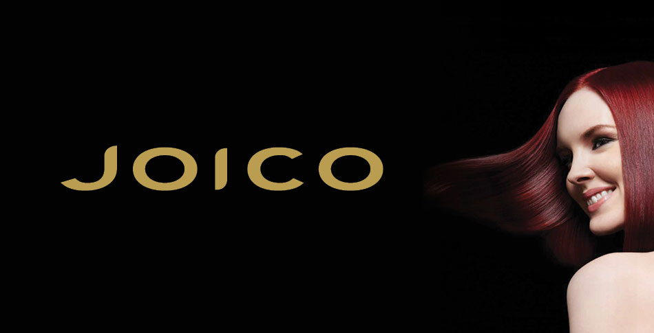 Woman with red hair with the Joico logo.