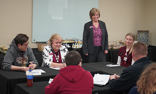 From left: Dr. Morna Foy, Wisconsin Technical College System (WTCS) president is joined by Dr. Shelly Mondeik, Mid-State Technical College president, and other Tour of Excellence attendees and Mid-State students at the Mid-State Healthcare Simulation Center on April 23.