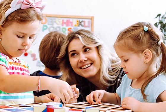 Early childhood professional working with young children.