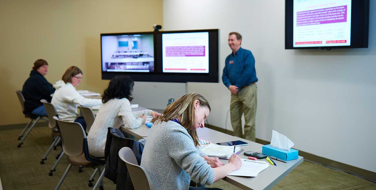 Teacher in front of small class