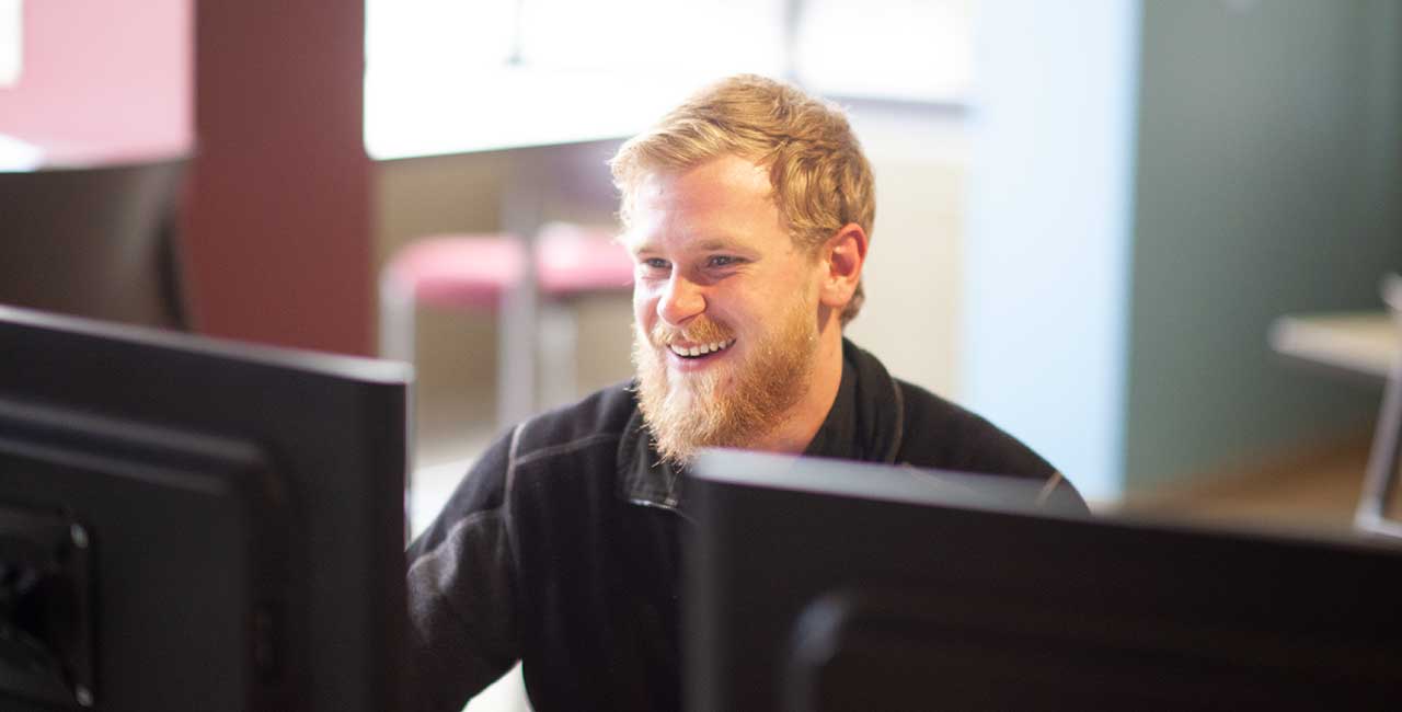 Mid-State Student filling out job application at a computer