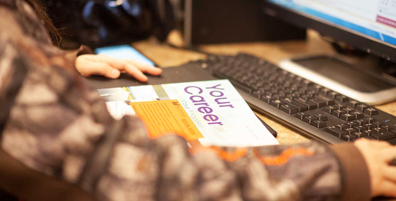 Career paths booklet wth computer in background