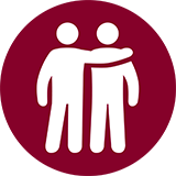 Icon of two people standing next to each other. 