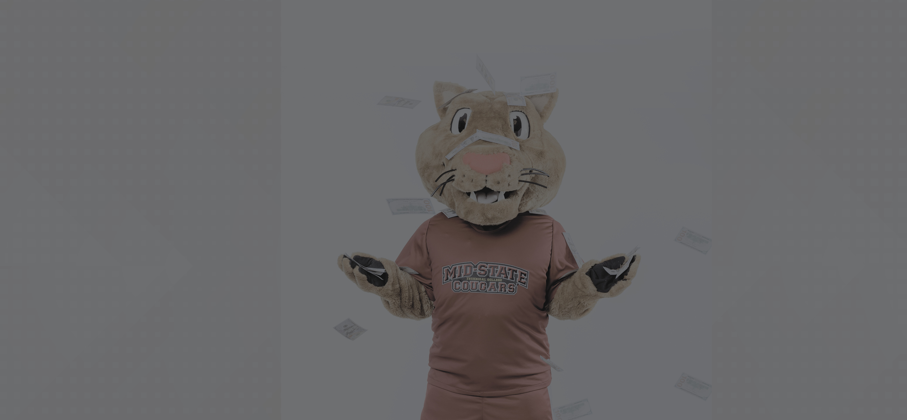 Mid-State Mascot grit with their paws in the air. Money floating down around Grit.