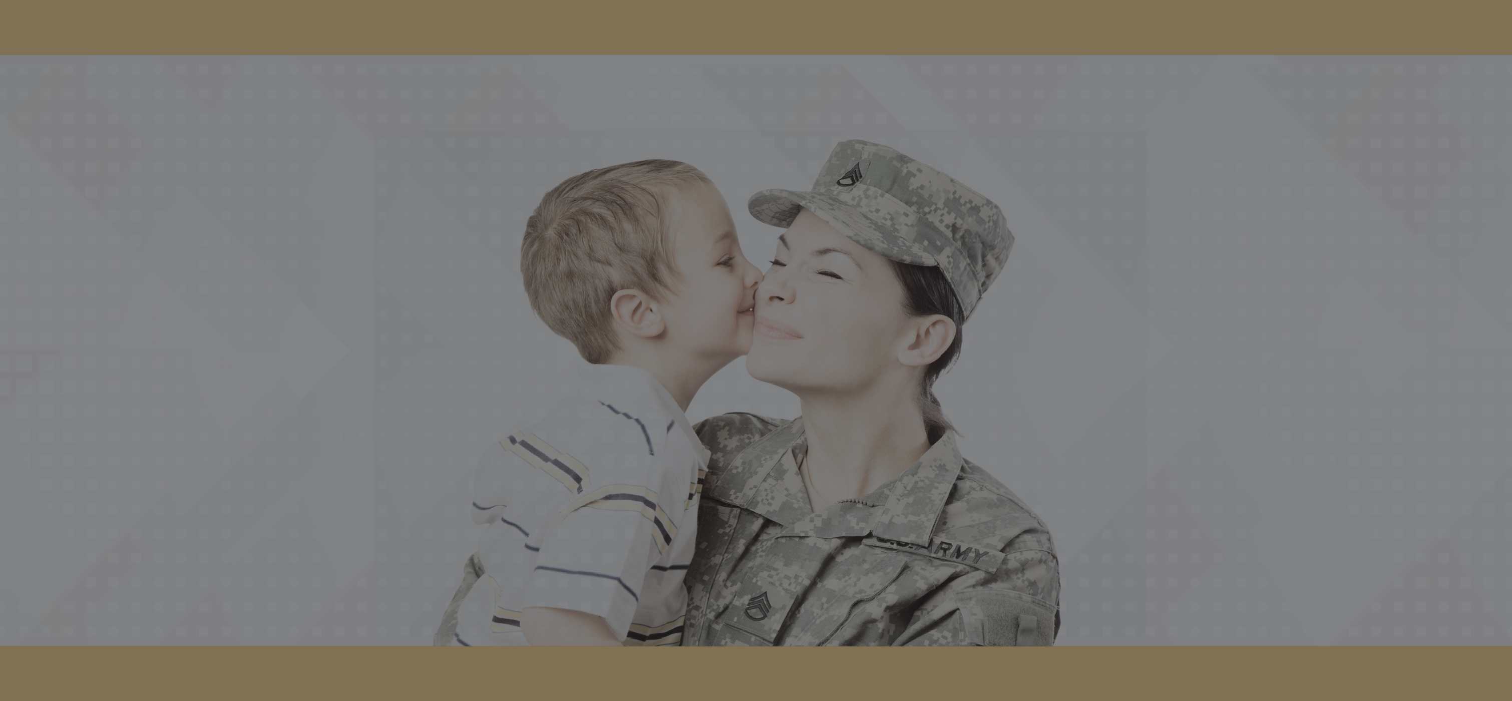 Person in military garb holding a kid who is kissing them on the cheek