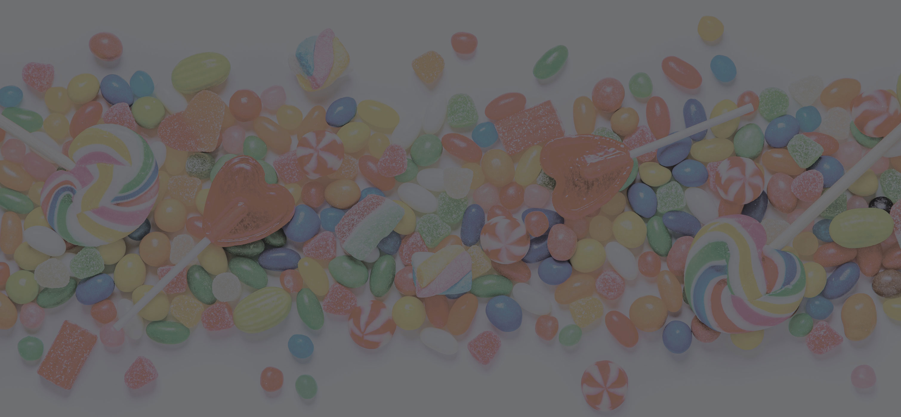 Assorted candy laying across a table