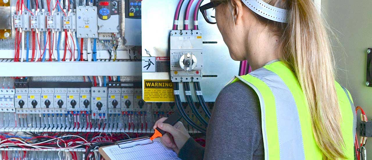 Person working in an open electrical box