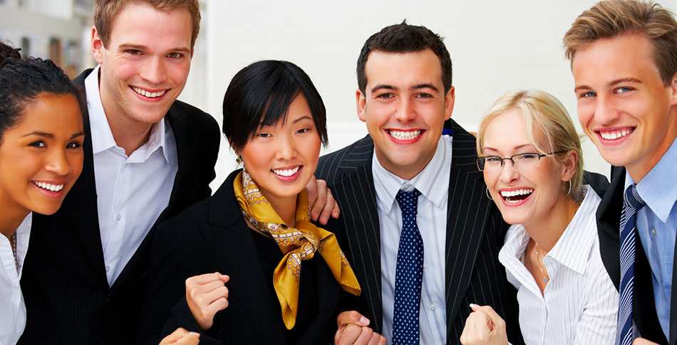 A group of adults dressed in business professional attire.