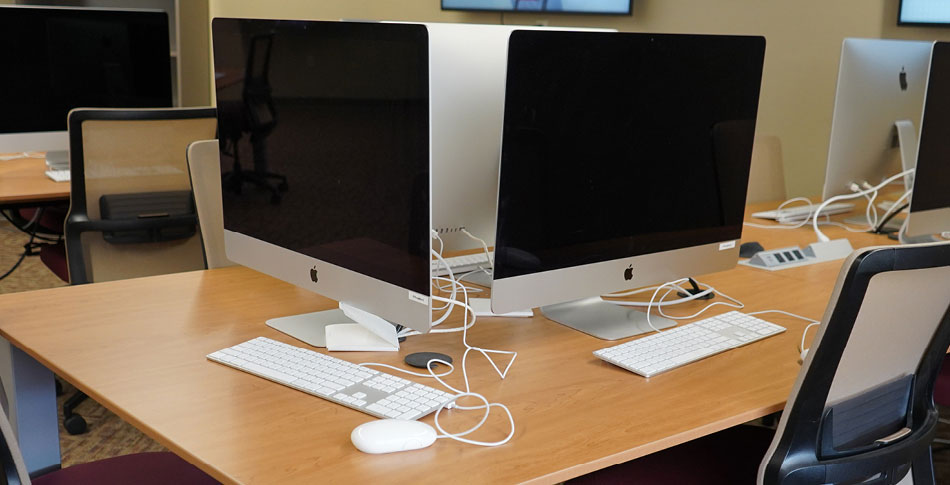 Monitors in a Mid-State computer lab.