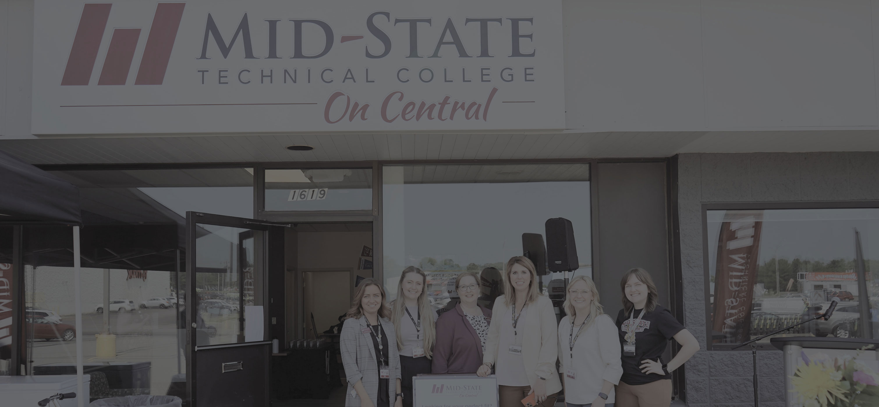Mid-State on Central Building with Enrollment staff posing out front