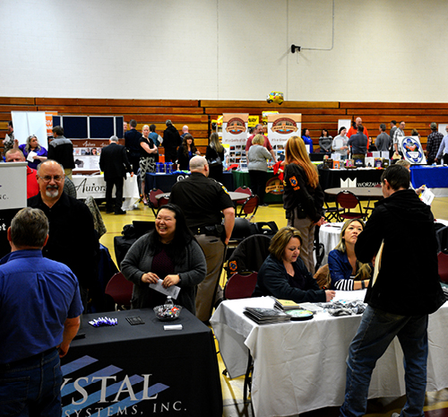 People attending a previous Wisconsin Education Fair set up in Mid-State's gym