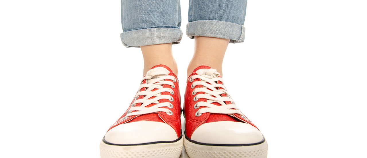 Photo of 2 feet in red shoes standing