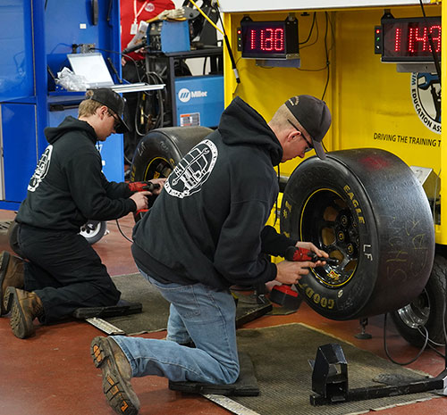 Program Showcase attendees compete in the pit stop challenge.