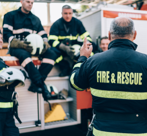 Firefighters sitting on a Firetruck