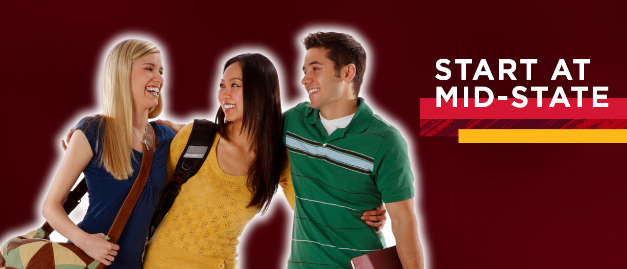 Three college students that are standing in a group.