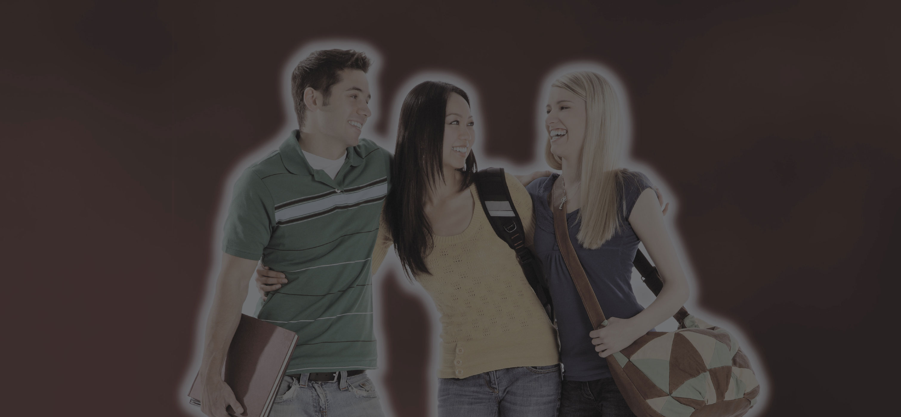 3 people with with arms around each other smiling carrying bookbags.