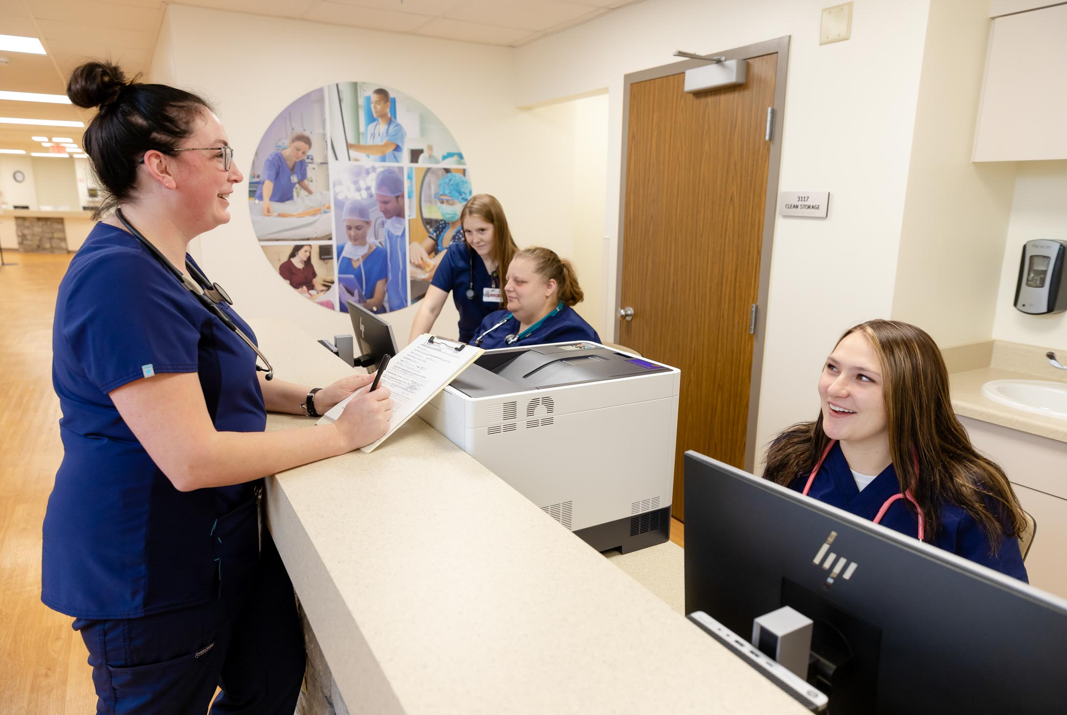Healthcare Simulation Center students at front desk.