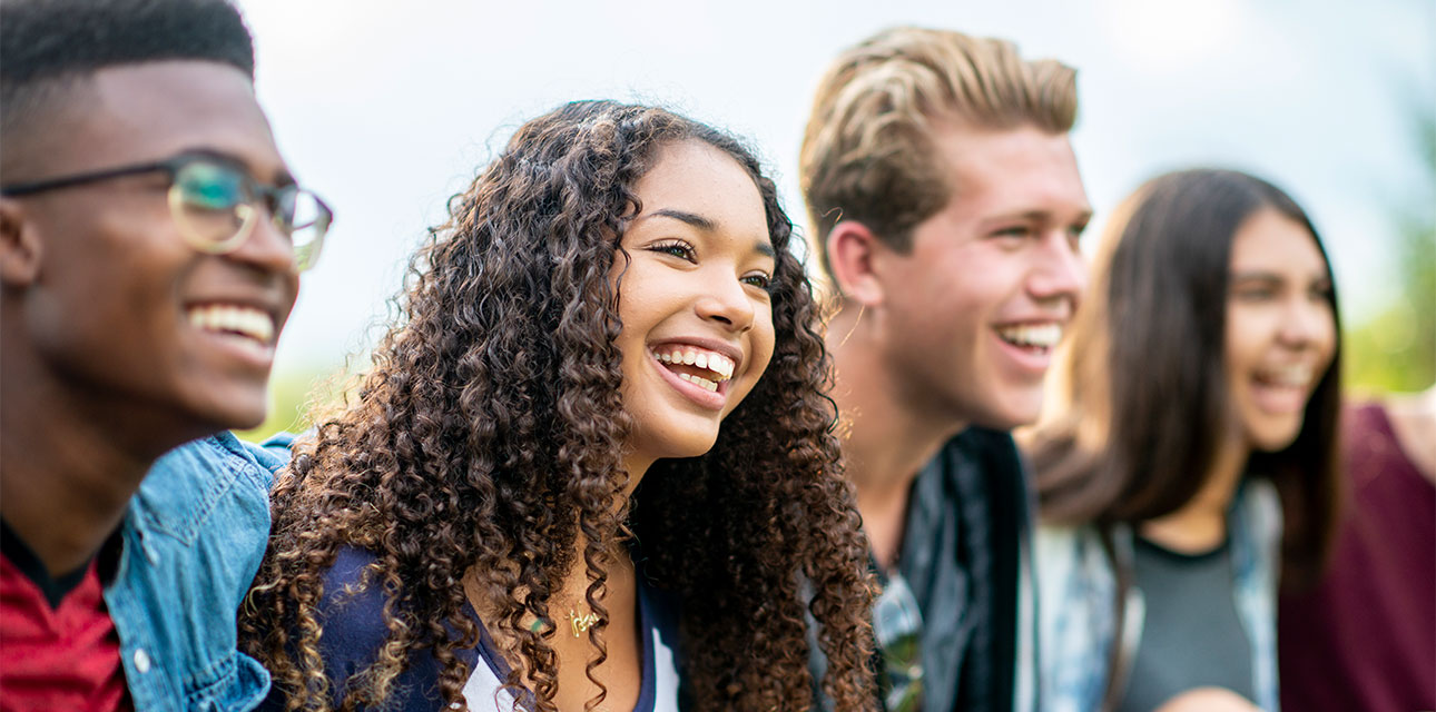 Group of middle school students smiling.