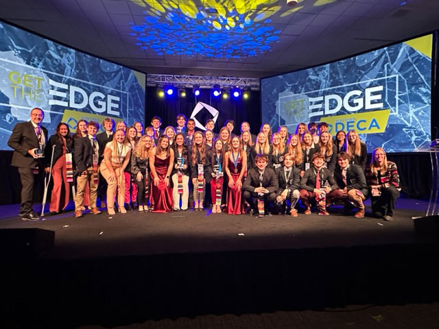 Wisconsin Rapids Lincoln High School DECA poses with Ron Rasmussen, Lincoln High School principal and Missy Skurzewski-Servant, Mid-State Technical College dean of Business & Information Technology.