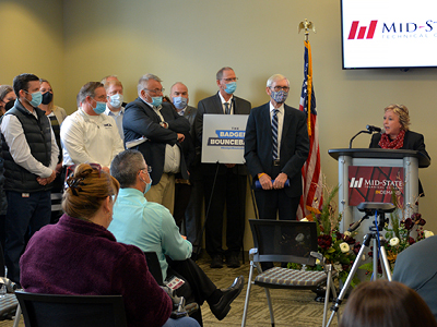 Mid-State Technical College President Dr. Shelly Mondeik receives the Workforce Innovation Grant program award for the College’s AMETA Center proposal surrounded by partners and supporters of the project, Dec. 12, on the Stevens Point Campus.