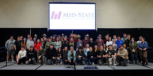 Admit Day attendees who have committed to attending Mid-State upon graduating from high school, on May 3 on the Wisconsin Rapids Campus. Also pictured; Mid-State’s mascot, Grit, and Mid-State’s president, Dr. Shelly Mondeik, center. 