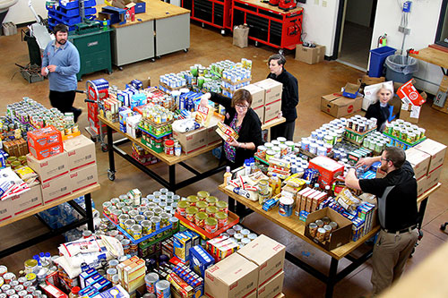 Mid-State Technical College employees make final preparations for over 7,000 pounds of food and household items before distribution to local food pantries on Nov. 14.