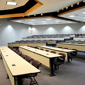 Auditorium style seating arrangement with tables