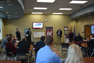 Mid-State Vice President of Workforce Development and Community Relations Bobbi Damrow introduces Gamber-Johnson representatives during the company’s donation to the College. L-R: Gamber-Johnson Vice President of Finance Brian Dewit, Chief Operating Officer Gautam Malik and President and CEO Brian Wagner.