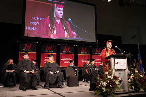 Student speaker Mara Daniels, Plover, delivering her speech at Mid-State’s spring commencement on the Wisconsin Rapids Campus