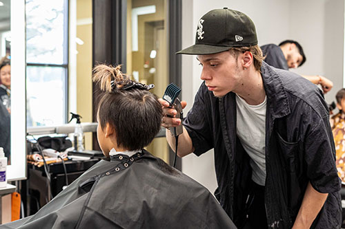 A 2024 “Cuts 4 Kids” participant receives a free haircut from a Barber Technologist student in the Salon at Mid-State in Wisconsin Rapids. This year’s event will be held on June 11.