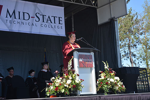 Student speaker Brittany Nelson, Plover, delivering her speech at Mid-State’s spring commencement on the Wisconsin Rapids Campus, May 14.