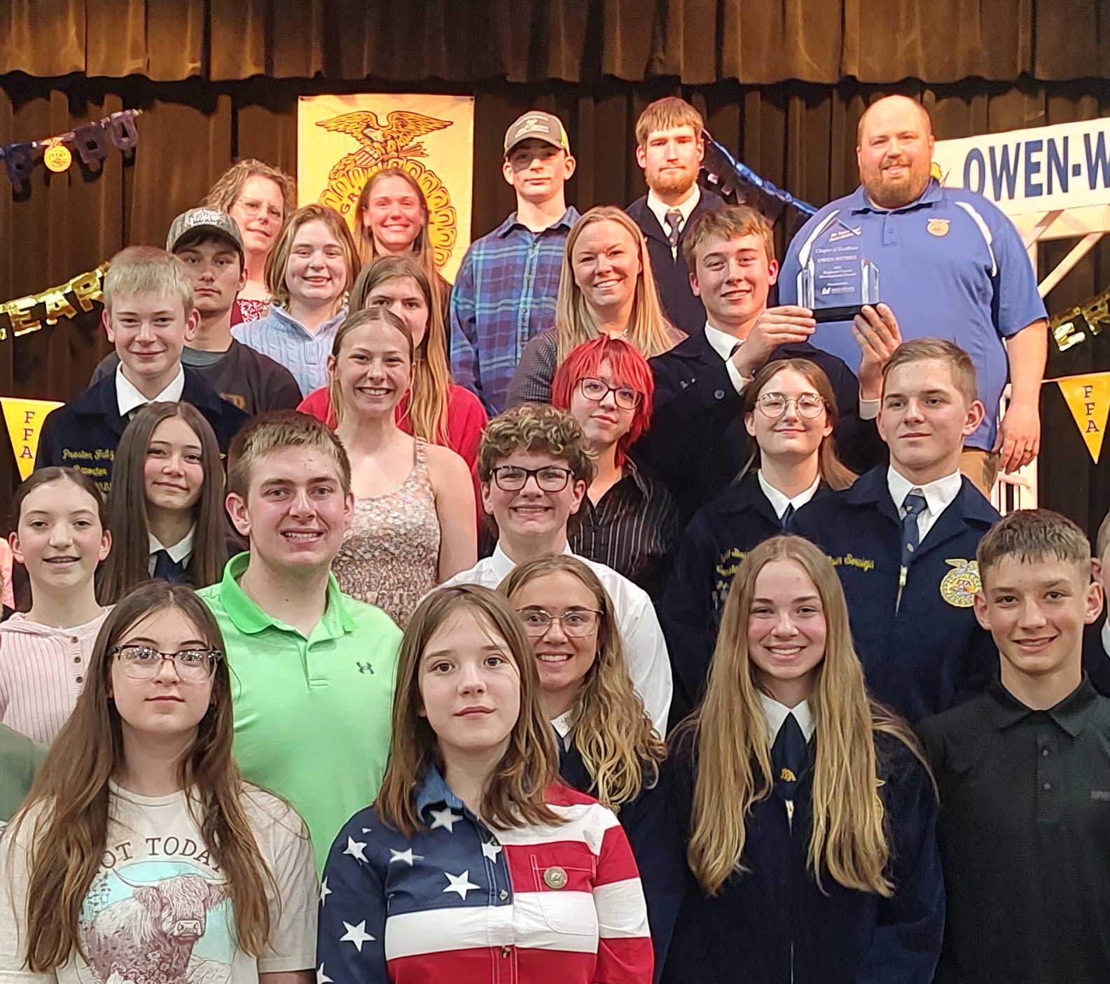 Owen-Withee High School FFA members receive Mid-State Technical College’s FFA Career Development Events (CDE) Chapter of Excellence Award at their annual FFA banquet on April 30, 2025. Also pictured are Travis Engel, Owen-Withee FFA chapter advisor; Teri Raatz, Mid-State Agribusiness instructor and faculty team lead; and Dr. Alex Lendved, Mid-State dean of the Marshfield Campus and School of Applied Technology. 