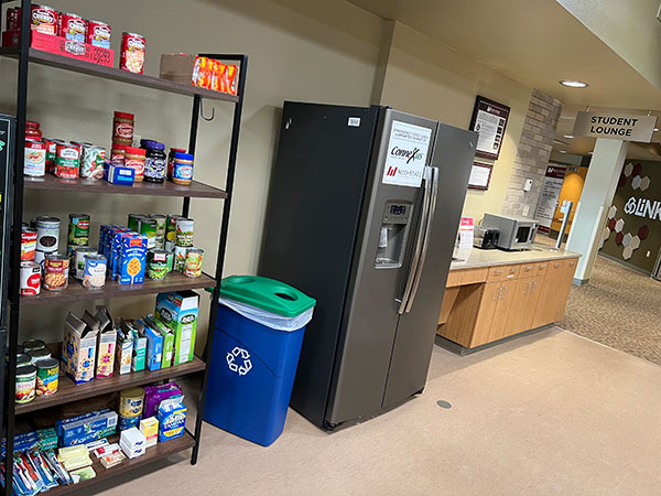 Marshfield Campus Food Pantry. Shelving with canned and boxed goods.