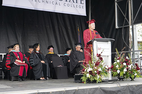 Student speaker and Construction Electrician (ABC) apprenticeship graduate Spencer Olejniczak delivers his speech at Mid-State’s spring commencement on the Wisconsin Rapids Campus, May 13, 2023.