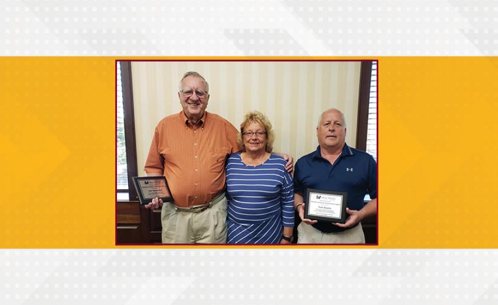 Mid-State Foundation Board of Directors President Mary Jo Green presents retiring board members Jim Shewchuk, left, and Tom Ekelin with plaques recognizing their long record of service on July 13 in Wisconsin Rapids.
