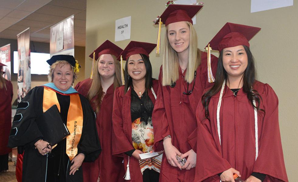 Mid-State’s president, Dr. Shelly Mondeik, with graduates just before the procession at the College’s commencement ceremony on the Wisconsin Rapids Campus, Dec. 10. 