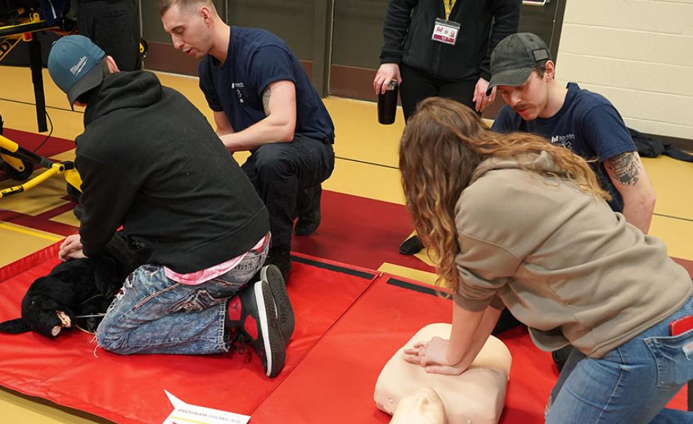 Program Showcase students learn how to provide CPR using a dog and a human manikin in a hands-on career exploration activity for Mid-State’s Emergency Medical Technician and Paramedic Technician programs during the event on the college’s Wisconsin Rapids Campus, March 7.