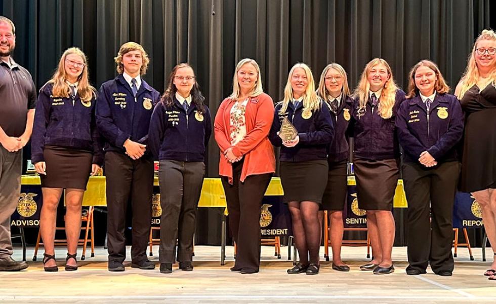 Dr. Alex Lendved (center), Mid-State Technical College dean of the Marshfield Campus and agriculture programs, presents the Chapter of Excellence Award to the Stanley-Boyd FFA chapter at Stanley-Boyd High School’s annual FFA Awards Banquet, May 6.