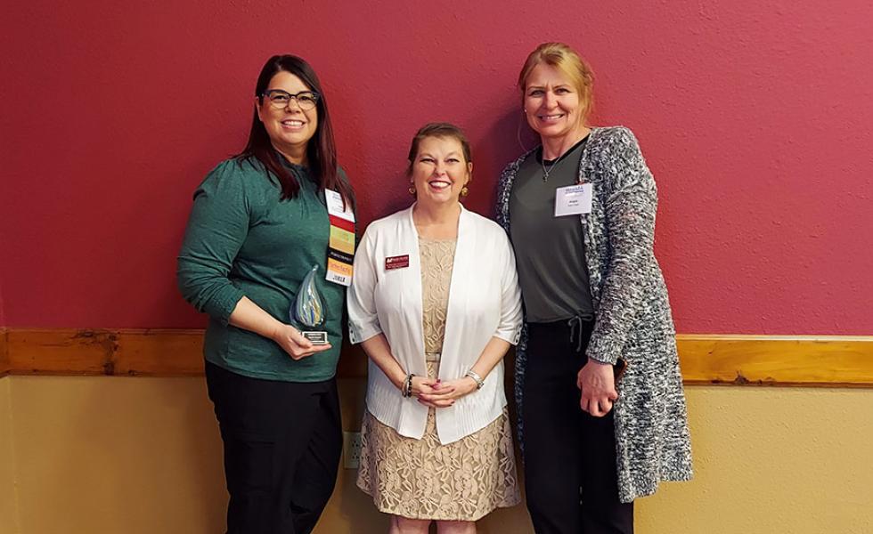 Julie Larsen accepts the Spirit of Wisconsin Health Information Management Association (WHIMA) Award, May 17. From left: Julie Larsen, Mid-State instructor and program director, Health Information Management; Dr. Colleen Kane, dean of the School of Health and the School of Protective & Human Services; Angela Voight, instructor, Health Information Management.