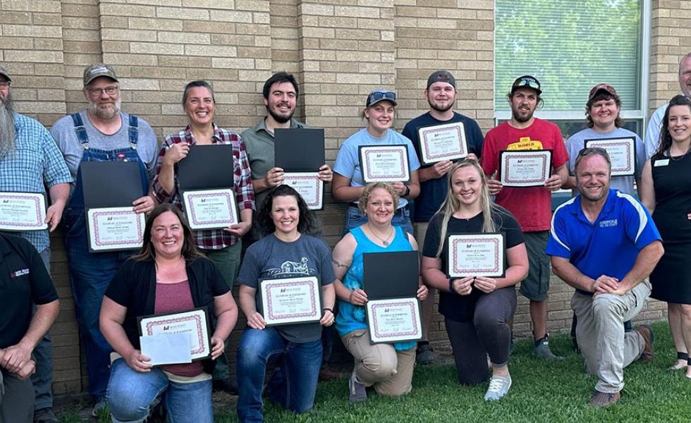 The twelve Meat Cutting and Butchery certificate completers with Adam Schlafke, Mid-State instructor and Master Meat Crafter; Mark Cournoyer, Auburndale High School agriculture science teacher; Betsy Leonard, Wisconsin Technical College System education director of agriculture, natural resources & STEM; and Randy Romanski, secretary of the Wisconsin Department of Agriculture, Trade and Consumer Protection (DATCP).