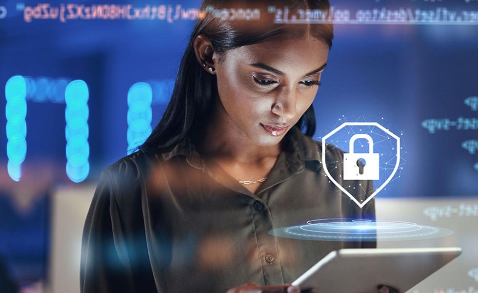Person looking at a tablet with a lock icon above it.