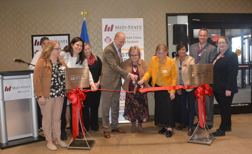 Cutting the ribbon at Mid-State’s new location in Marshfield Clinic.