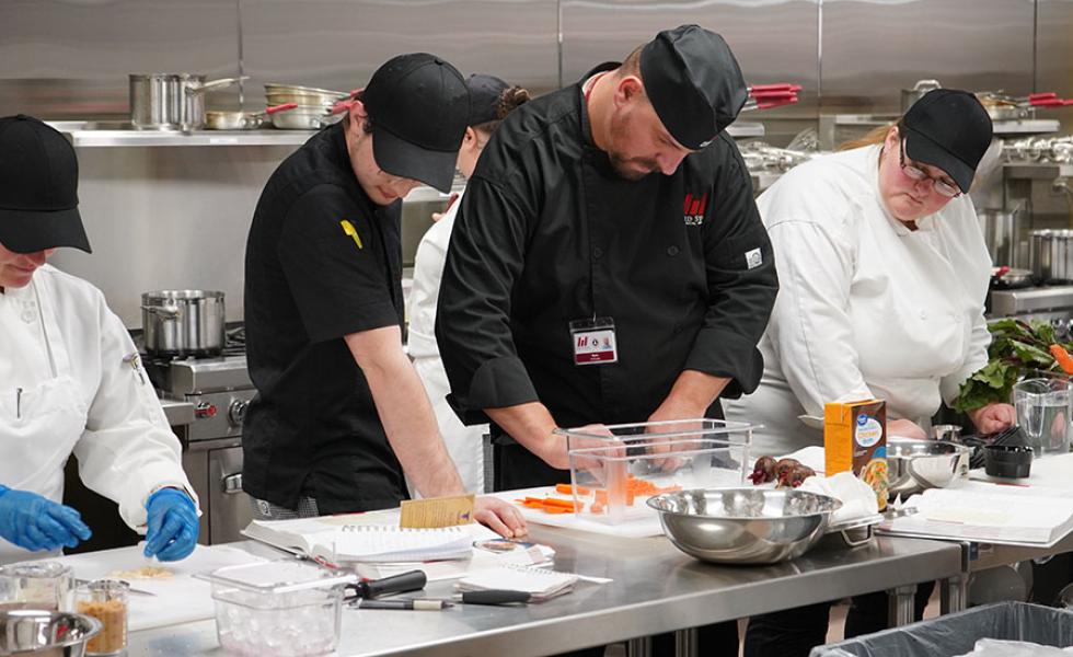 Mid-State Technical College Culinary Arts instructor with students practicing skills in the Culinary Kitchen on the Wisconsin Rapids Campus.
