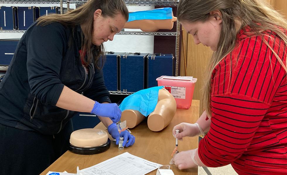Mid-State Technical College Nursing students practice giving injections during a skills lab. Data recently reported by the Wisconsin Board of Nursing reveals Mid-State Nursing students taking the 2023 NCLEX-RN achieved a 100-percent pass rate.