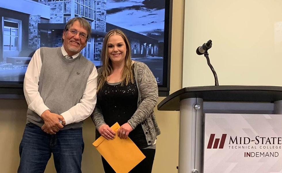 From left: Oneida poet Louis V. Clarke at the 2023 Wisconsin Writers Connect event with Maria Boggs, Mid-State University Transfer-Associate of Science student and a 2023 Write on the Money contest winner.