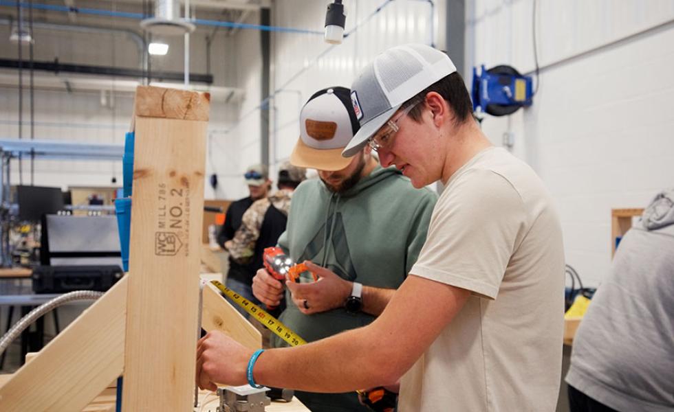 Mid-State Technical College Construction Electrician (IBEW-NECA) apprentices measure to install outlet boxes. The apprenticeship is one of 13 offered at Mid-State and eligible for the Tools of the Trade scholarship program each year.