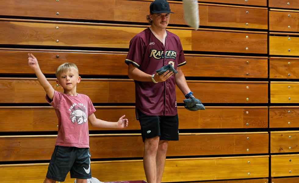 A “Rafters Meet-and-Greet” attendee competes in the Cornhole challenge against a Rafters player at the 2024 event held on Mid-State’s Wisconsin Rapids Campus. This year’s event will be held on June 11.