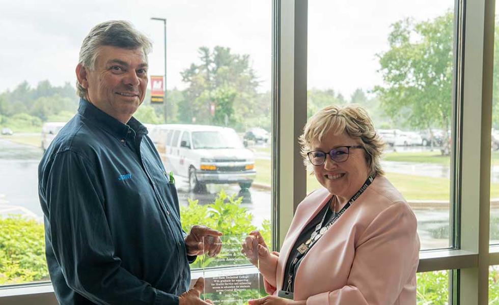  WATEA Co-Founder Jerry Brickner, left, and Mid-State Technical College President Dr. Shelly Mondeik hold a plaque of appreciation presented by Mid-State to WATEA honoring their three-year partnership to launch and deliver a free shuttle service for students. The plaque was presented at the shuttle celebration event held on Mid-State’s Wisconsin Rapids Campus, June 16.