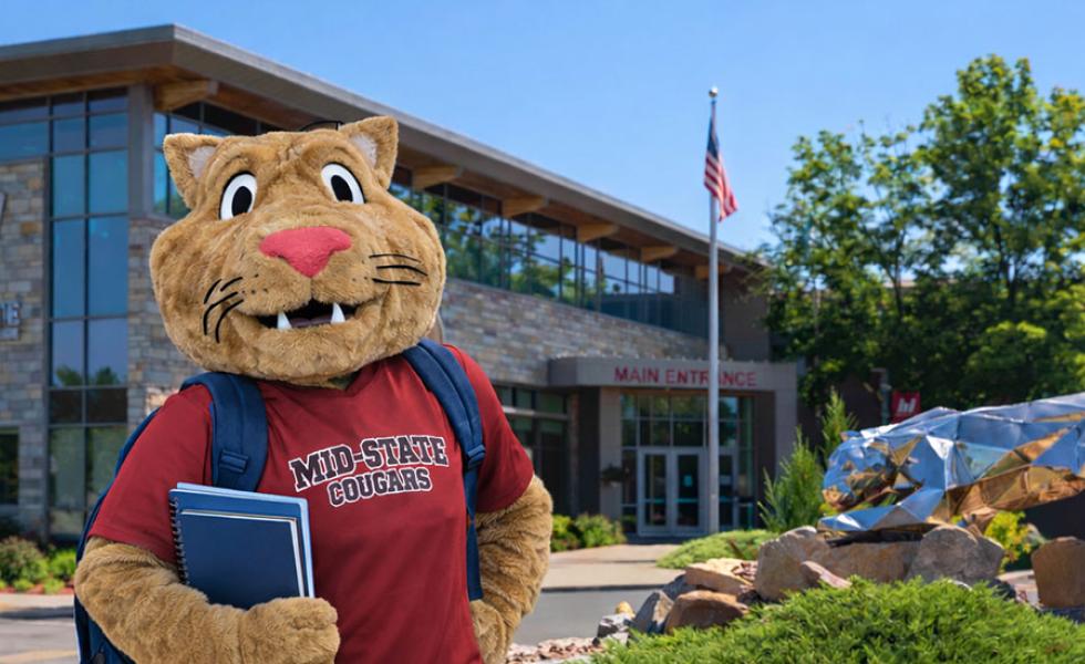 Mid-State’s mascot, Grit, stands in front of the main entrance of the College’s Wisconsin Rapids Campus.