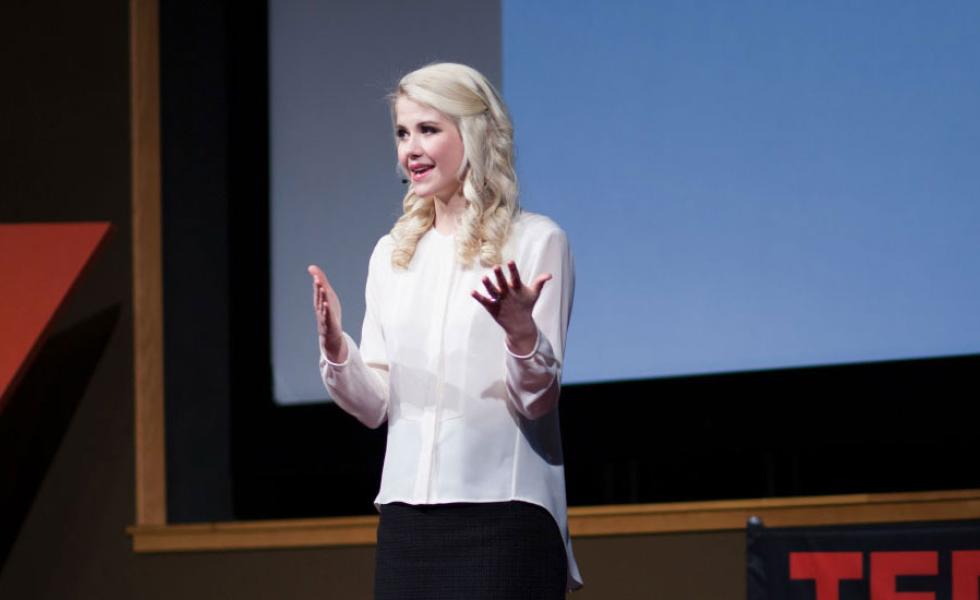 Elizabeth Smart on stage, addressing an audience.